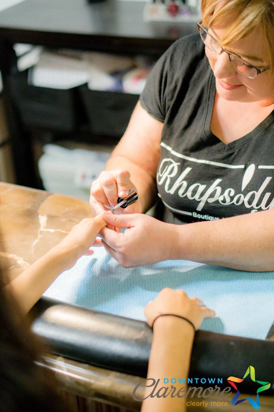 Carol, owner of Rhapsody providing a nail servce.