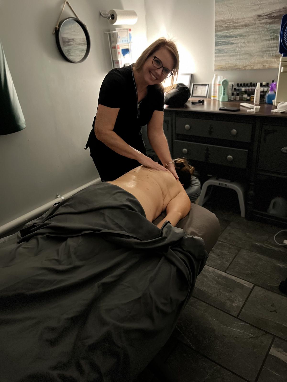 Carol, owner of Rhapsody providing a massage.